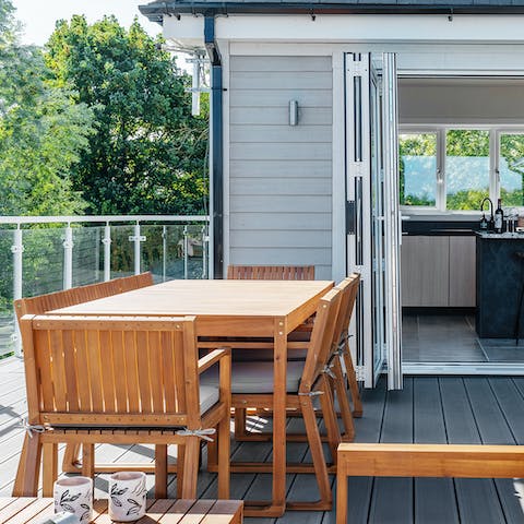 Share memorable meals alfresco overlooking the lake