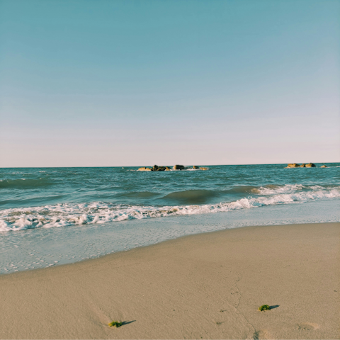 Sunbathe on the golden Plage de la Gravette, seven-minute walk away