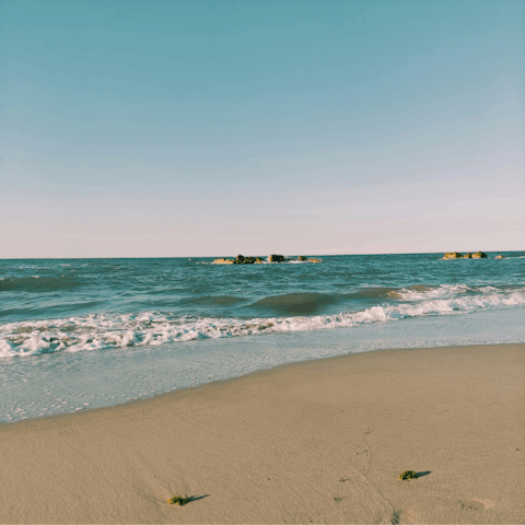 Sunbathe on the golden Plage de la Gravette, seven-minute walk away