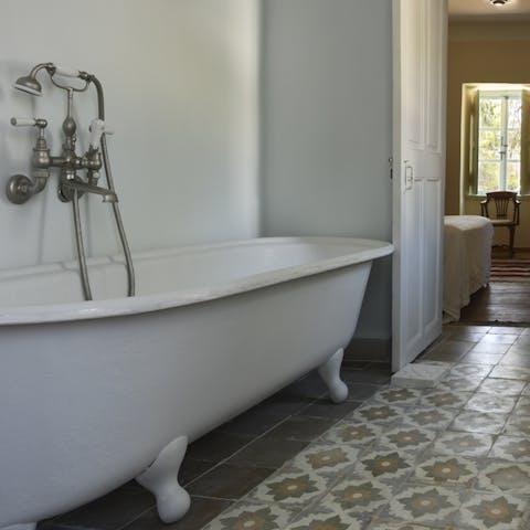 Treat yourself to a luxurious bath in the freestanding tub