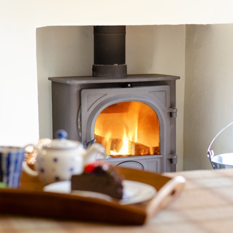 Make yourself at home beside the fireplace