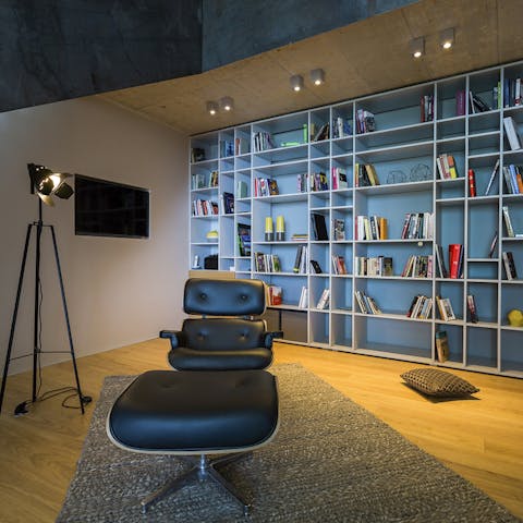 Settle down with a good book in the library’s leather recliner