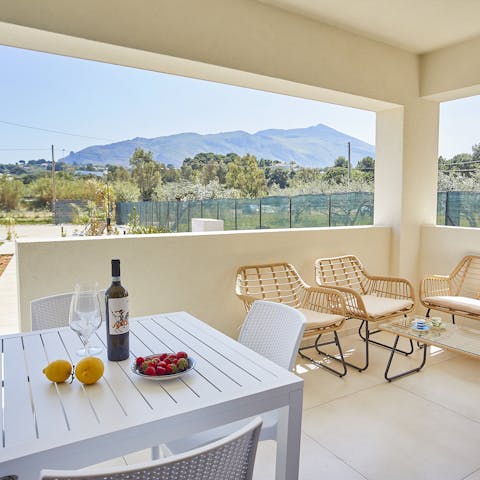 Soak up the Sicilian green landscapes over sundowners