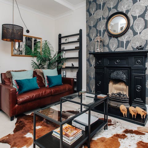 Gather on the comfortable sofas for a movie night, a glass of wine in hand