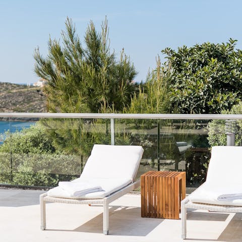 Snooze on the sun loungers after a morning at the on-site tennis court