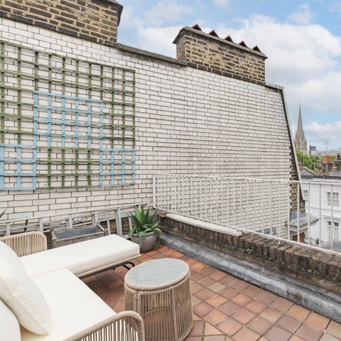 Sit above the Kensington rooftops with a church spire in view