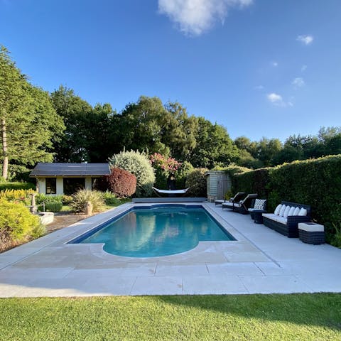 Take a dip in the pool, secluded by trees