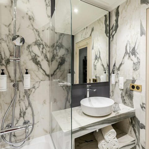 Get ready in the marble bathroom for a night out in the City of Light