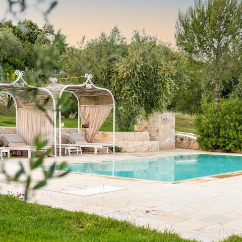 Grab an ice-cold drink and a book and secure a poolside spot for the day