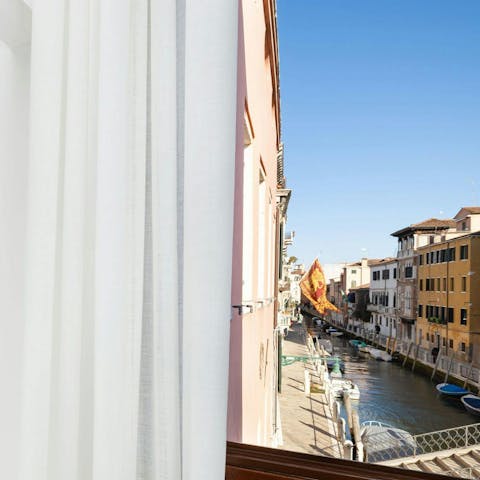 Watch gondolas gliding by from the main bedroom