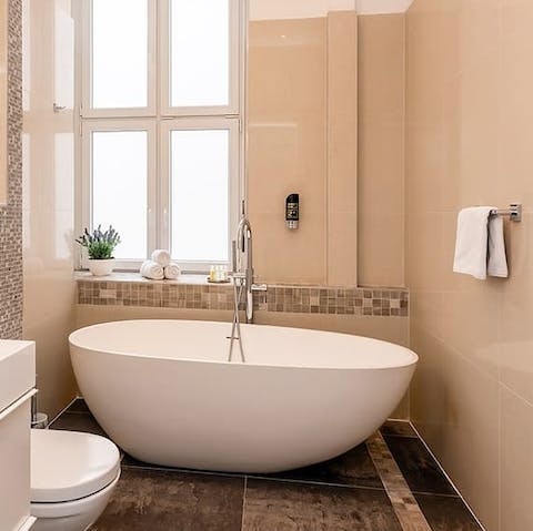 Soak in the luxurious bathtub