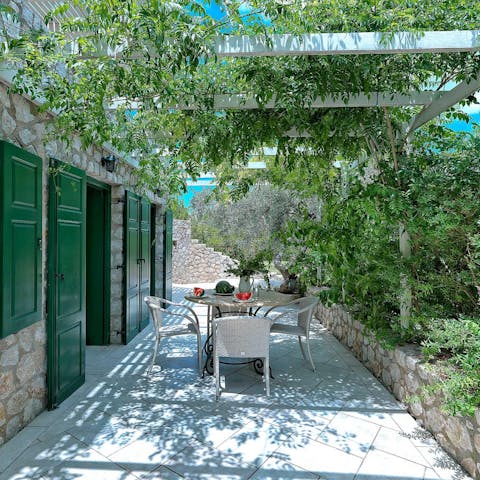 Take a break from the sunshine underneath the leafy pergola