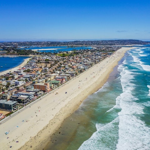 Stroll along miles of white, sandy beaches