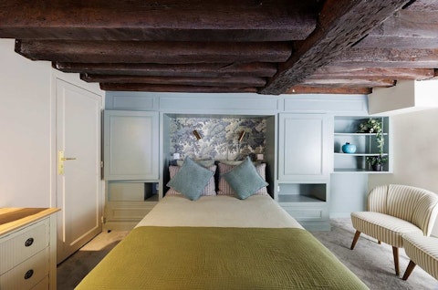 Sleep beneath centuries-old timber beams