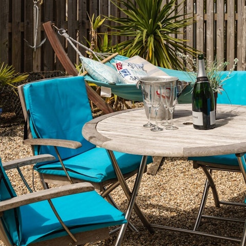 Dine and gossip alfresco in the sunny courtyard