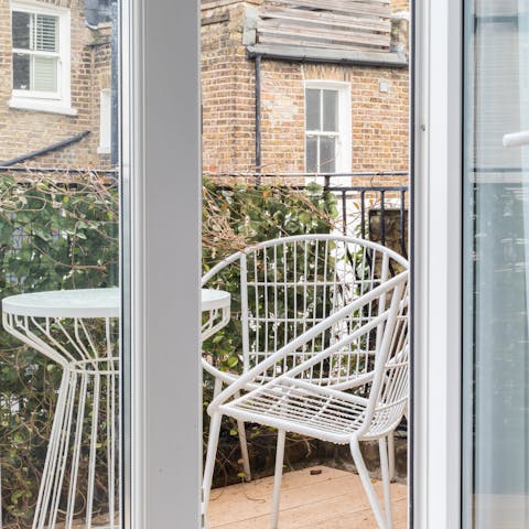French doors onto a decked balcony