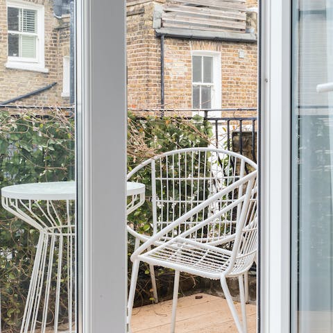 French doors onto a decked balcony