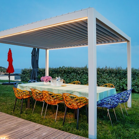 Dine alfresco in the garden, overlooking the sea
