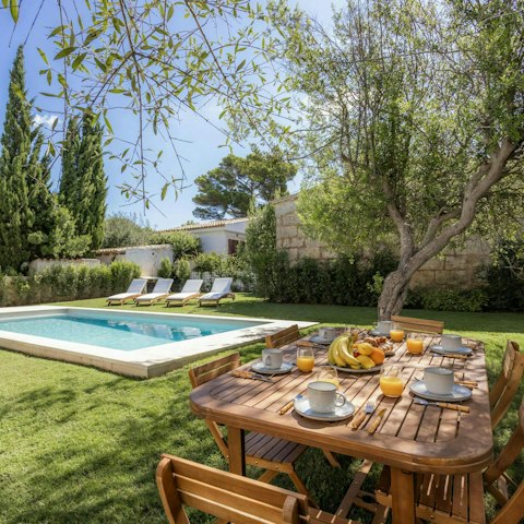 Enjoy breakfast alfresco, shaded by olive trees