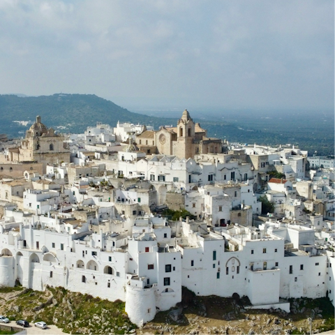 Explore white-washed Ostuni – an eight-minute drive away