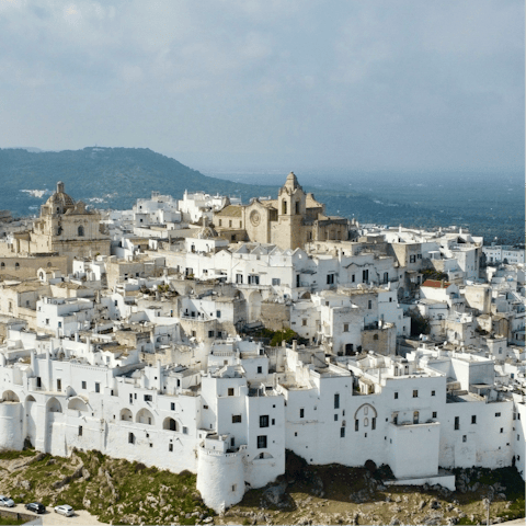 Explore white-washed Ostuni – an eight-minute drive away
