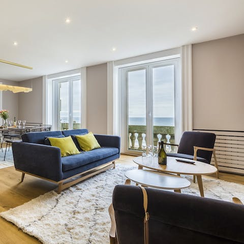 Look out to sea from your stylish light-filled living room
