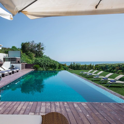 Swim a few laps of the private pool or unwind in the poolside Jacuzzi