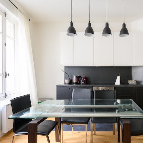 Start mornings with fresh coffee and croissants at the stylish glass dining table