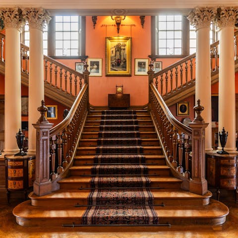 Gather at the double staircase for an epic group photo