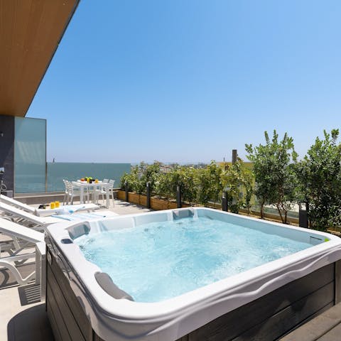 Soak in the sea views from the private Jacuzzi