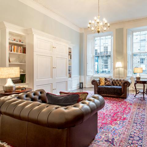Relax on the vintage Chesterfield sofas with a dram of Scottish whisky in hand