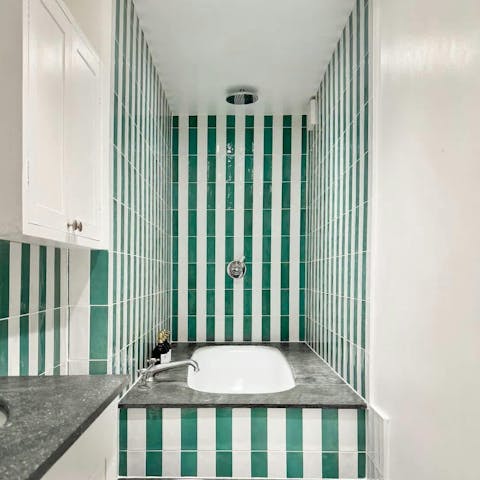 Unwind in a bubble bath in the unique bathroom
