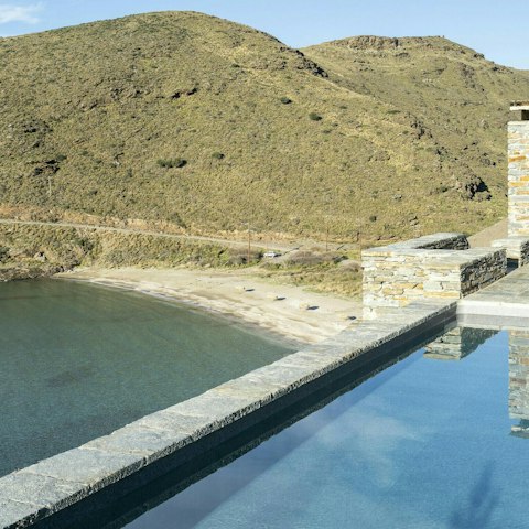 Admire peaceful bay views from the infinity pool