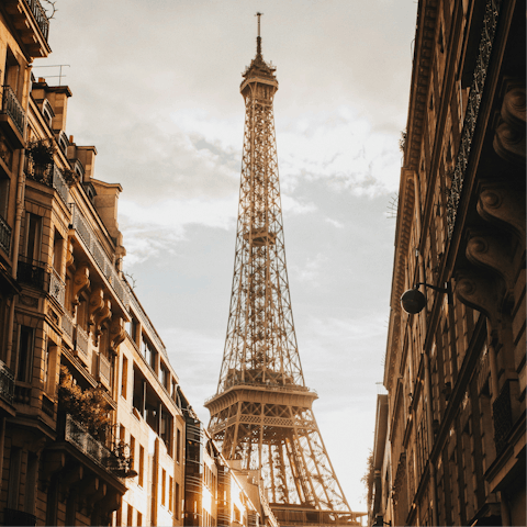 Head to the top of the Eiffel Tower, a fifteen-minute walk away