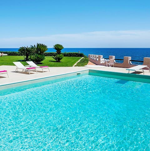 Cool off in the crystalline waters of the outdoor pool