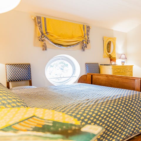 Unusual design touches like this porthole-style window