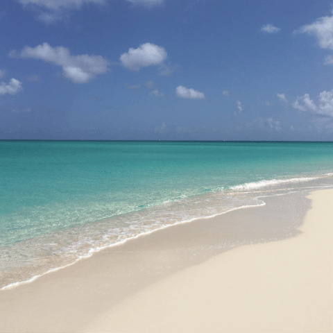 Stay on the pristine waterfront of Long Bay Beach