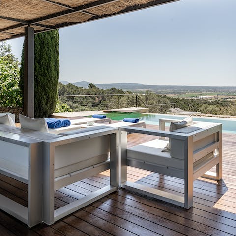 While away afternoons under the covered terrace, a cocktail and good book in hand