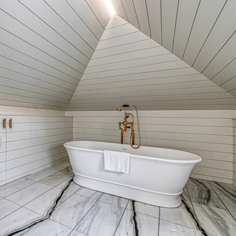 Sneak away for a soak in the luxurious freestanding bath