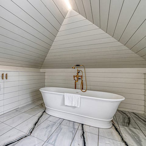 Sneak away for a soak in the luxurious freestanding bath