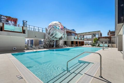 Cool off in the communal pool beneath open skies