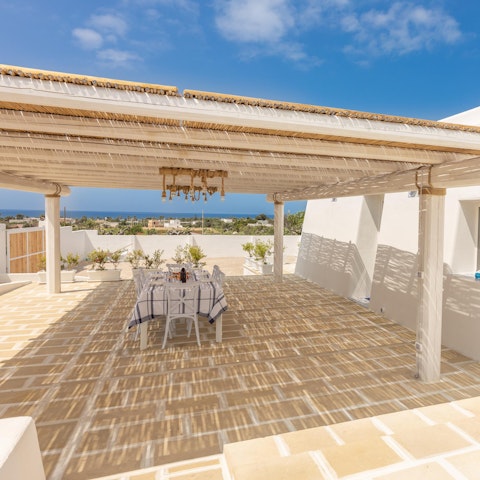 Dine around the shaded outdoor table