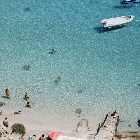 Dip in the crisp waters of Talamanca beach, 5 kilometres away