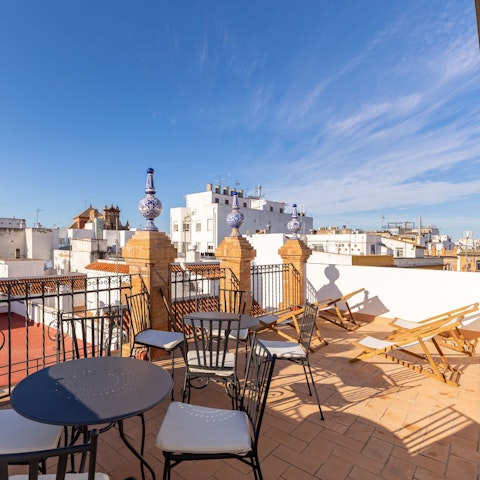 Admire the views of Seville from the shared terrace