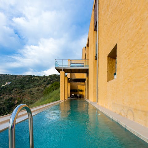 Slip into the crystal-clear waters of the private pool