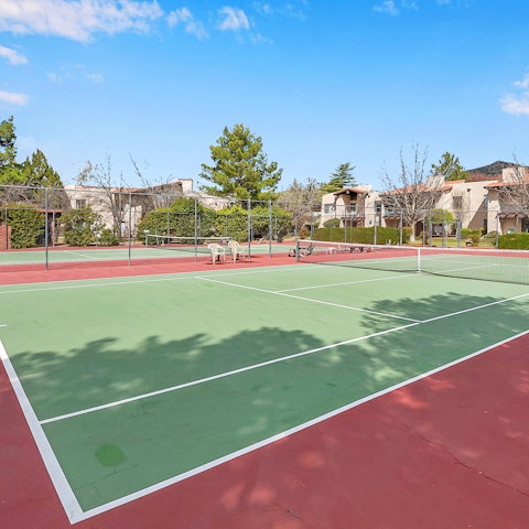 Start the day with a friendly game of tennis on the shared courts