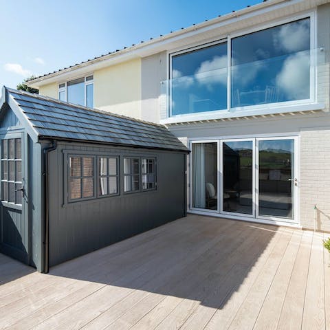 Toast the day’s end from the terrace as the sun goes down