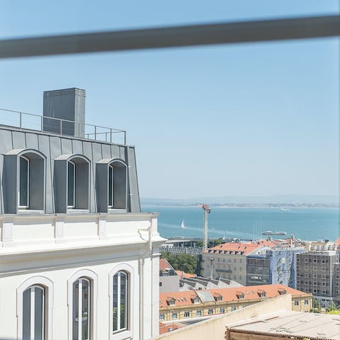 Admire breathtaking views from the floor-to-ceiling French windows