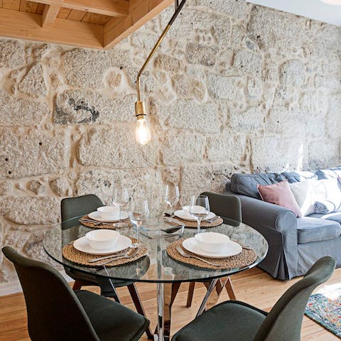 Enjoy intimate meals together at the glass table under the glow of the pendant