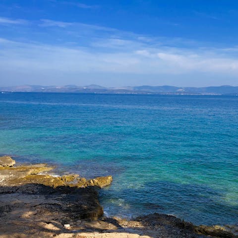 Admire the beaches and blue waters of nearby Sutivan